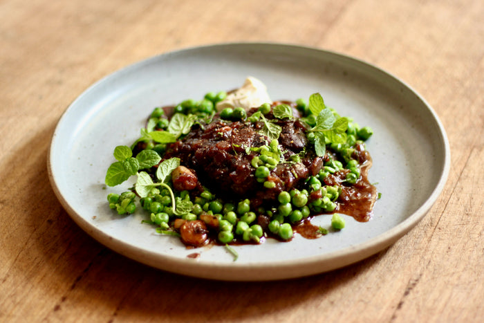 Braised Lamb Neck Rosettes with Minted Peas and Sour Cream