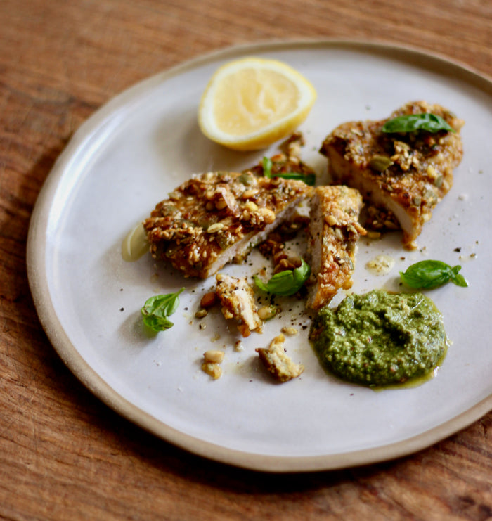 Herb Nut-crusted Pork Schnitzel with Hippie Veggies Nutty Pesto and Lemon