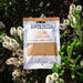 GH Produce Island Curry Mix packet surrounded by greenery and white flowers